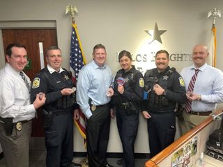 six police officers posing for photo; Todd Hutchinson in on the right in a red striped tie