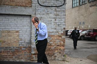 man in blue button down shirt and tie