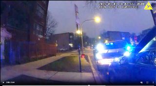 Photo of an unmarked police SUV with emergency lights on, pulled in front of a car already stopped along the side of the road.